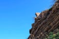 Ruins of brick house in broken rock mountain after earthquake tsunami disaster.