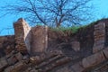 Ruins of brick house in broken rock mountain after earthquake tsunami disaster.