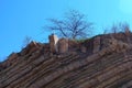 Ruins of brick house in broken rock mountain after earthquake tsunami disaster.