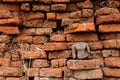 Ruins of buddha statue with brick background Royalty Free Stock Photo