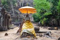 Ruins buddha statue image in archaeological site at Vat Phou