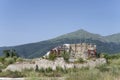 ruins of building engulfed by lush vegetation, Amatrice, Italy