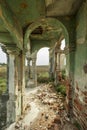 ruins of a building with rubble fallen on the ground