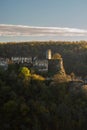 Ruins of Cabrad castle during autumn sunrise with fall coloured trees