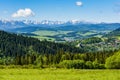 The ruins of the Castle in Czorsztyn over the water reservoir. On the horizon a beautiful mountain range - the Tatra Mountains Royalty Free Stock Photo