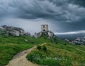 ruins of a castle in the mountains in stormy weather Royalty Free Stock Photo