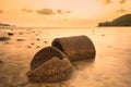 The ruins Cement pipe on the sea in sunset time.Beautiful seascape.Thailand