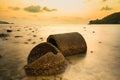 The ruins Cement pipe on the sea in sunset time.Beautiful seascape.Thailand