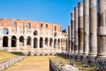 Ruins of the Colosseum and the columns next to the temple of Venus in Rome Royalty Free Stock Photo