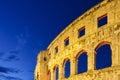 The ruins of the Colosseum in Rome, Italy. The Colosseum against the background of the sky in the evening. Night illumination on t Royalty Free Stock Photo