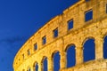 The ruins of the Colosseum in Rome, Italy. The Colosseum against the background of the sky in the evening. Night illumination on t Royalty Free Stock Photo