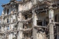 Ruins of destroyed houses, heaps of metal reinforcement concrete