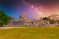 Ruins of El Caracol observatory temple, Chichen Itza, Yucatan, Mexico, Maya civilization with Milky Way Galaxy stars night sky Royalty Free Stock Photo