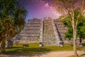 Ruins of El Osario pyramid, Chichen Itza, Yucatan, Mexico, Maya civilization with Milky Way Galaxy stars night sky