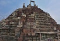 Ruins of the famous Angkor. Stone stairs with traces of destruction from time and weather lead to the top of the Bapuon temple