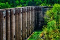 Ruins in the forest. Abandoned hydro electric structure