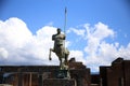 Ruins of the Forum of Pompeii with a statue of Centaur, against the blue cloudy sky, Pompeii, Campania, Italy