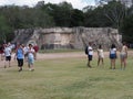 Ruins of great platform of Venus building with tourists at Chichen Itza city in Mexico on February