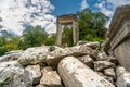 The ruins of Hadrian Gate in the ancient city of Termessos, framed by trees and a rocky foreground Royalty Free Stock Photo