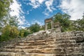 The ruins of Hadrian Gate in the ancient city of Termessos, framed by trees and a rocky foreground Royalty Free Stock Photo
