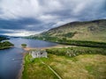 The ruins of historic Kilchurn Castle and jetty on Loch Awe Royalty Free Stock Photo