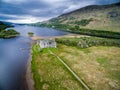 The ruins of historic Kilchurn Castle and jetty on Loch Awe Royalty Free Stock Photo