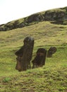 The ruins of huge Moai on the slope of Rano Raraku volcano, Rapa Nui national park on Easter Island, Chile Royalty Free Stock Photo
