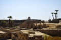 Ruins of Karnak Temple complex with palm trees (ancient Thebes). Luxor, Egypt, museum, travel. Royalty Free Stock Photo