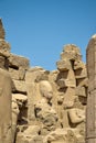 Ruins of the Karnak Temple complex with sculptures and columns carved with ancient Egyptian hieroglyphs and symbols Royalty Free Stock Photo