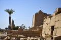 Ruins of Karnak Temple complex with sculptures, statues and columns carved with ancient Egyptian hieroglyphs and symbols Royalty Free Stock Photo