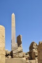 Ruins of Karnak Temple complex with statues, sculptures and pillars carved with ancient Egyptian hieroglyphs and symbols Royalty Free Stock Photo