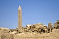 Ruins of Karnak Temple complex with statues, sculptures and pillars carved with ancient Egyptian hieroglyphs and symbols Royalty Free Stock Photo