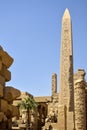 Ruins of Karnak Temple complex with statues, sculptures, pillars and columns carved with ancient Egyptian hieroglyphs and symbols Royalty Free Stock Photo