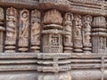 Dancing  lovemaking and mythical characters in stone at Konark  Sun Temple  India Royalty Free Stock Photo