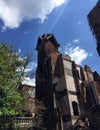 Ruins of large old tower of fire damaged home