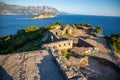 Ruins of medieval fortress Tvrdava Mogren at the shore of Adriatic sea, Montenegro.