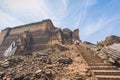 Ruins of the Mingun Pagoda with tourist walking down from the top of the pagoda