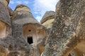 The ruins of monastic cells of an old ancient cave temple in the mountain valley of Cappadocia