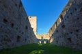 Niederhaus castle ruins with their castle walls, castle windows and a beautiful blue sky with a green meadow Royalty Free Stock Photo