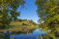 Niederhaus castle ruins under a blue sky with water reflection in the lake Royalty Free Stock Photo