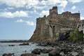 Ruins of a Norman castle on a volcanic cliff in the village of Aci Castello on the island of Sicily Royalty Free Stock Photo