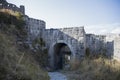 Ruins of an old castle. Entrance door and window of an old castle. Fortress towers and walls