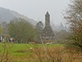 Ruins of an old church in the fog in Glendalough monastic site