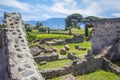 Ruins of the old city of Pompeii with the remains of houses and kitchen utensils pots, vases. Gardens and volcano Vesuvius in th Royalty Free Stock Photo