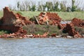 destroyed house made of red bricks after the flood and stagnant water Royalty Free Stock Photo