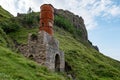 The ruins of old diatomite factory and rusty chimney in Isle of Skye, Scotland