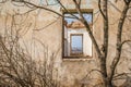 The ruins of an old earthen house without a roof. Holes in the wall at the site of windows and doors Royalty Free Stock Photo