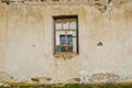 The ruins of an old earthen house without a roof. Holes in the wall at the site of windows and doors Royalty Free Stock Photo