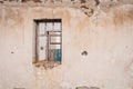 The ruins of an old earthen house without a roof. Holes in the wall at the site of windows and doors Royalty Free Stock Photo