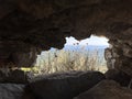 Ruins of an old fortress, a hole in the stone. Hole in the ancient fortress wall. Brick structure with a through hole Royalty Free Stock Photo